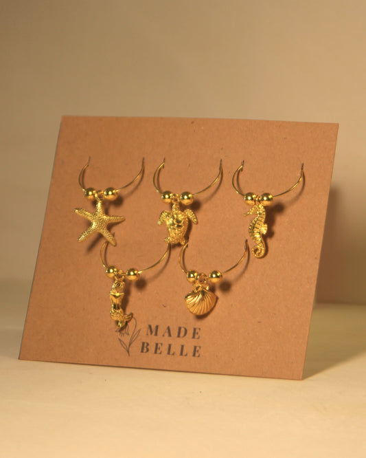The Golden Reef Wine Charm Set